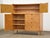 A mid century modern maple tall dresser with cane doors designed by Edmond Spence. Made in Sweden. Professionally...