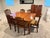Discover a stunning antique dining set that promises to elevate your dining experience. The exquisite extending dining...