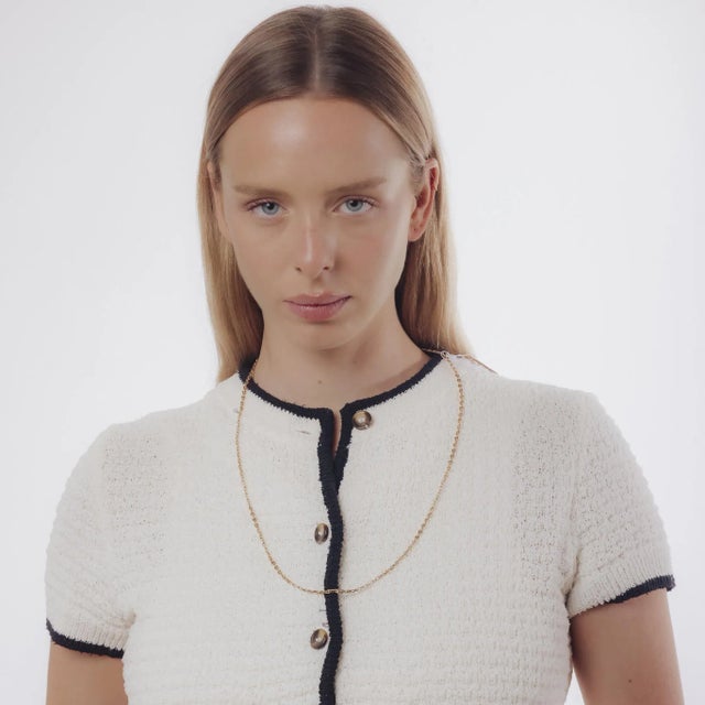 A sleek vintage 18k yellow gold necklace measuring 28 inches, offering timeless elegance and versatile wear for layering...