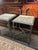 This is a pair of antique neoclassical-style accent tables showcasing distinct European craftsmanship, reminiscent of...