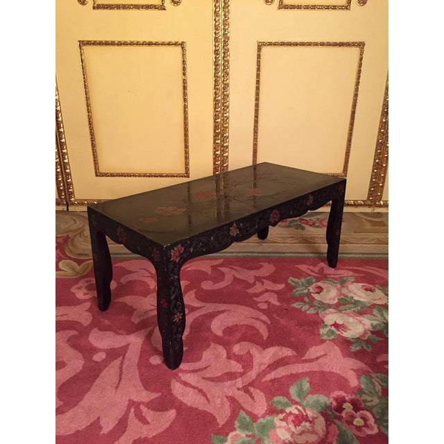 Rectangular body with curved frame, black frame and carving carvings scattered throughout the body, circa 1970s.