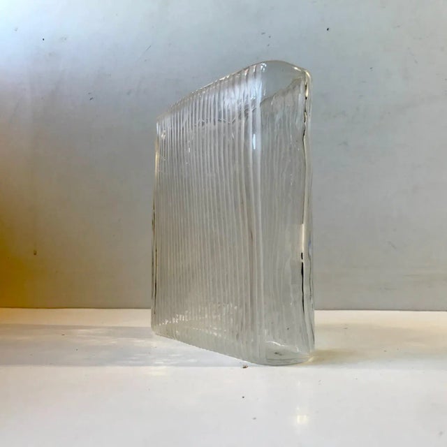Heavy block/square vase with vertical white stripes. It was made by Orrefors in Sweden during the 1960s or 70s and was...