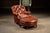 c. 1970s/1980s; Hickory Chair Furniture Co. - Hickory, NC Vintage brown leather chair and ottoman pair. This lived-in set...