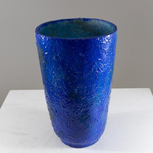 Description Vase signed A. Galati, made of glazed ceramic in shades of deep blue and turquoise. The body has a tall and...