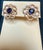 A fabulous pair of earrings with an enormous amount of look and sparkle! almost 1 carat In the center natural sapphire set...