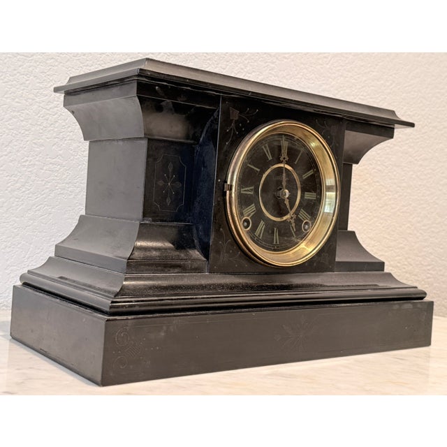 Ingraham Victorian Ansonia mantel clock with a black with a lacquer finish, runs perfect and rings ever hour. Gold rim...