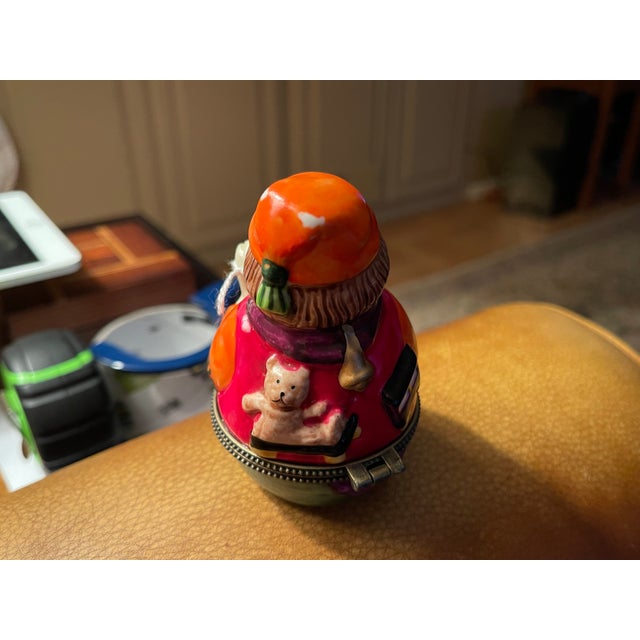 This is a little hinged porcelain container, made by Villeroy & Boch, Mettlach Germany. It's the figure of a man, possibly...