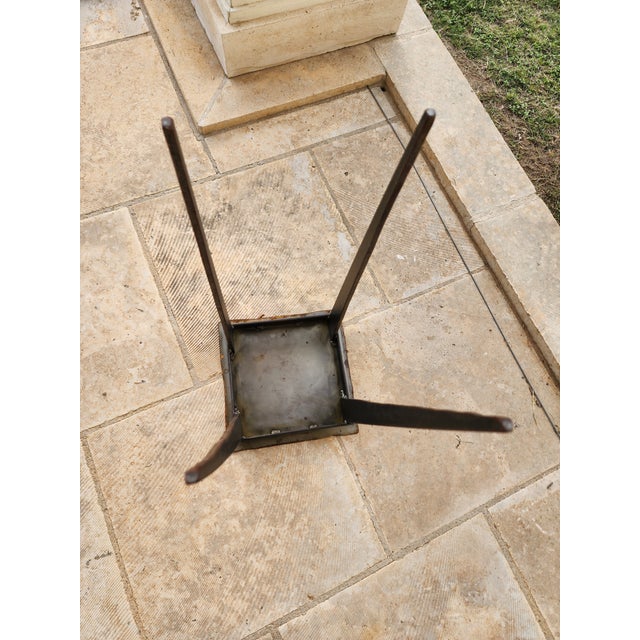 Jon Sarriugarte designed and signed table from 1993. This small brutalist iron table is very sculptural and the legs are...