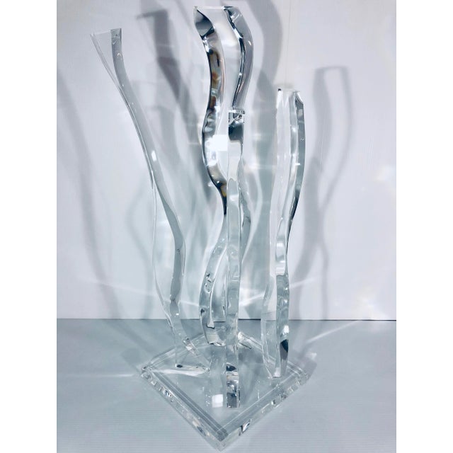 Abstract sculpture finished in all Polished Lucite. Original artwork by renowned creator Hivo Van Teal.
