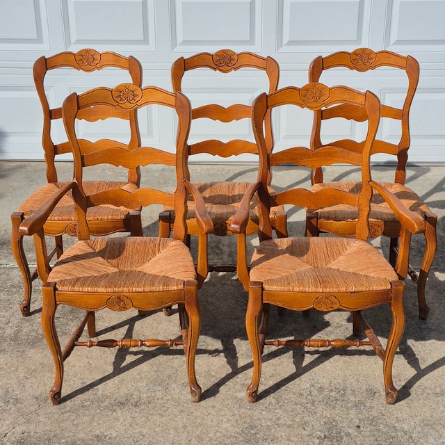 This is a truly lovely set of 5 vintage French country style ladderback rush seat chairs from high-end furniture retailer...