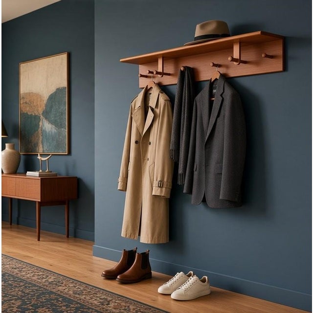 Even the jacket deserves Danish design! An unusual and well-made teak hat rack, model 208, designed and manufactured by...