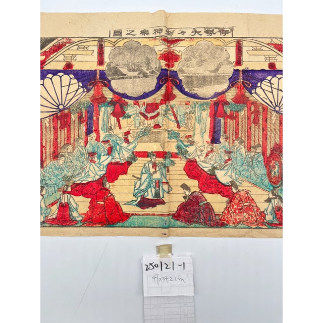 This vintage artwork captures a solemn and reverent moment within a classical Japanese imperial court. At the center, a...