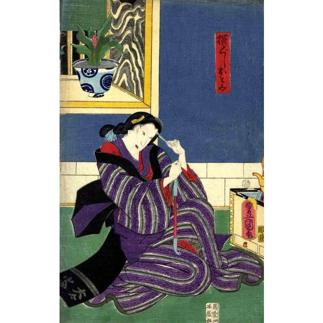 The geisha Otomi is an original modern artwork realized by Utagawa Kunisada in 1860. Woodcut print Oban from a triptych....