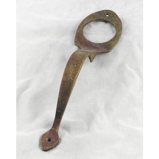 Traditional style door pull handle made of bronze or brass with a cylinder lock insert. Good condition with surface wear...