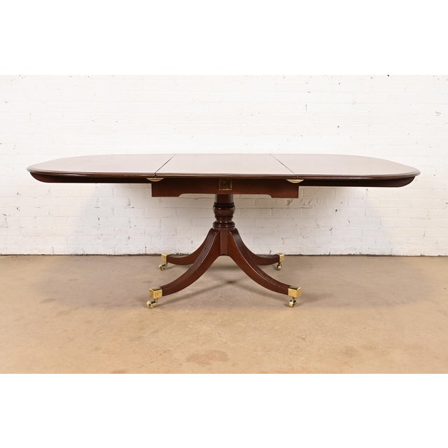 A very rare and exceptional antique English Regency or Georgian pedestal extension dining table or breakfast table By...