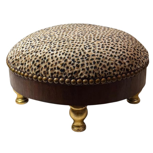 A charming Italian early 19th century footstool with beautifully carved and giltwood legs, newly upholstered in iconic...