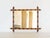 This charming antique-style French wall mirror features an elegant faux bamboo frame, reflecting the refined and playful...