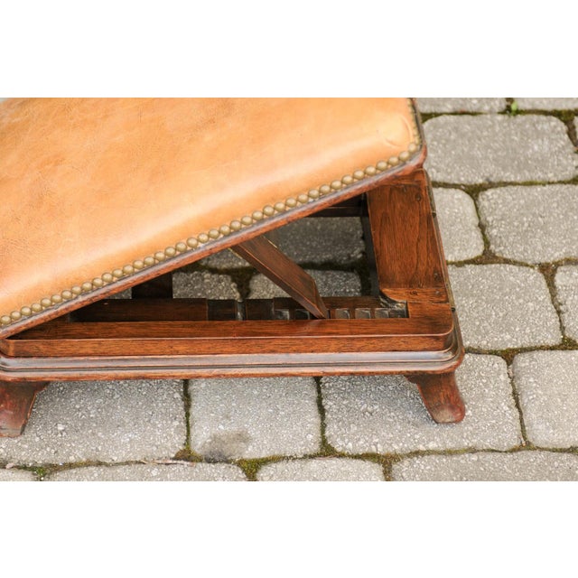A pair of English wooden metamorphic footstools from the mid-19th century, with caramel leather tops. Born in England...
