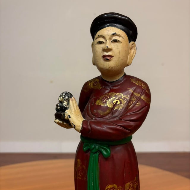 Add color, history, and personality to your space with this captivating pair of vintage Vietnamese figurines. Beautifully...