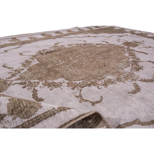 Beautiful Persian vintage Tabriz Hand-knotted wool rug with a brown field. This piece has gray accents in an all-over...