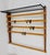 An elegant modernist wall-mounted coat rack from the 1950s. An original and old vintage object, designed and executed by...