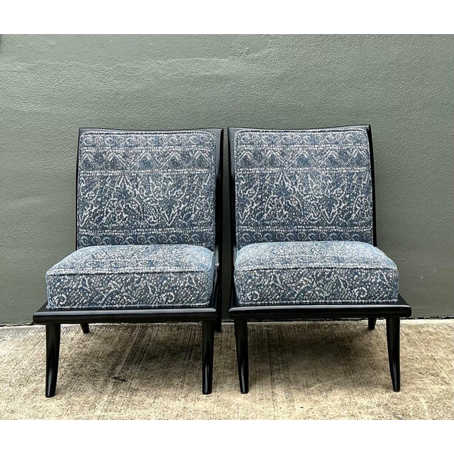 This elegant pair of vintage slipper chairs from the 1950s reflects the refined modernism associated with designs after...