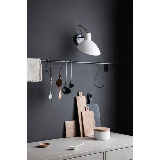 Pair of Vittoriano Viganò 'VV Cinquanta' sconces in black for Astep. Viganò was the art director of Arteluce, the company...