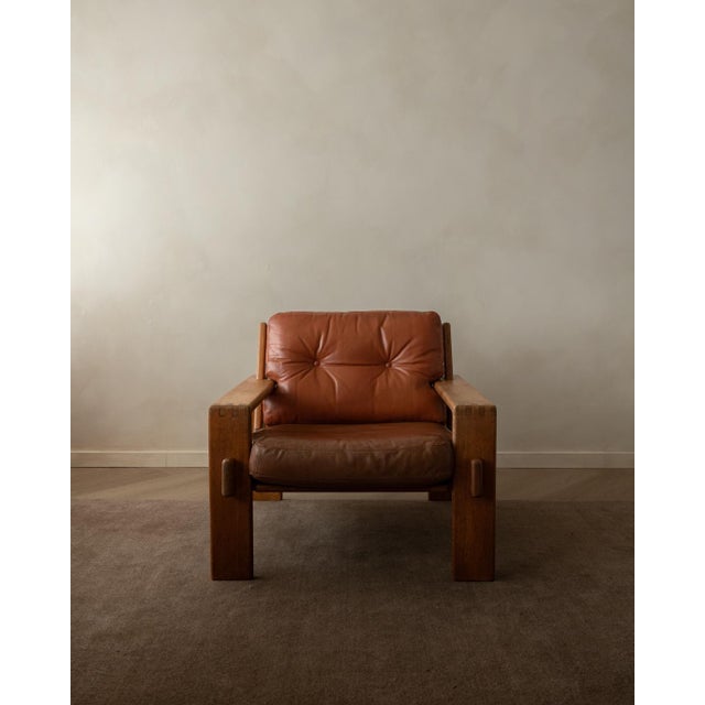 A striking vintage bonanza lounge chair by esko pajamies for asko, made in finland in the 1960s. The bonanza series is...