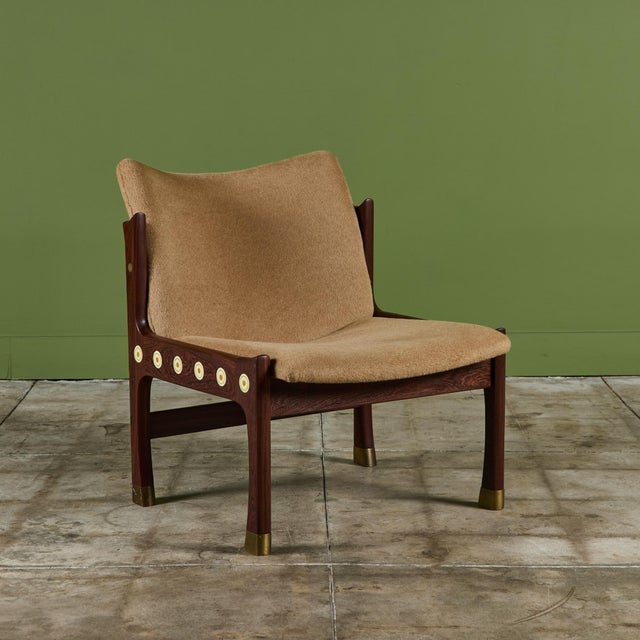 Rosewood lounge chair by Ib Kofod Larsen, c.1970s, Israel. This lounge chair for the Megiddo Collection features round...
