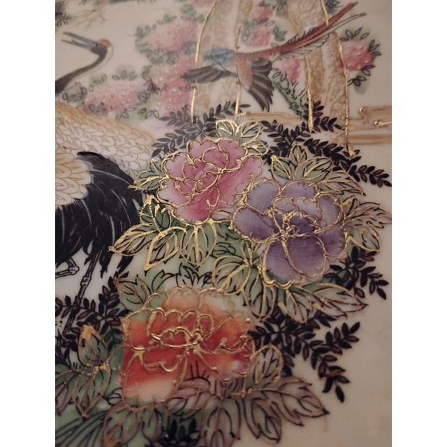 High End hand painted decorative porcelain plate. This plate is hand painted in a traditional Asian scene of birds and...