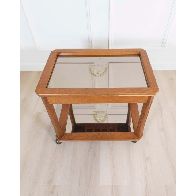 This very rare champagne trolley comes from a French palace. The two mirrors above and below are engraved with a coat of...