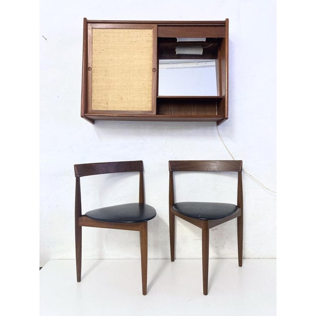 Wall cabinet with two compartments from the 1960s. One compartment contains a mirror, the other a shelf. The cabinet has...