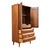 This 1960s Lane "First Edition" armoire is a handsome example of American mid century modern design, built in warm walnut...