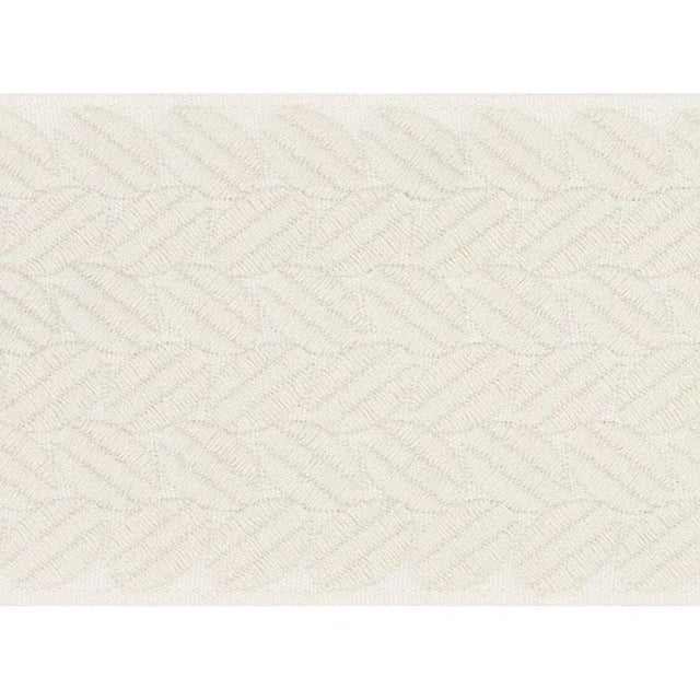 An exuberant embroidered tape with a leaf-like pattern rendered in satin stitching; inspired by a document in our...