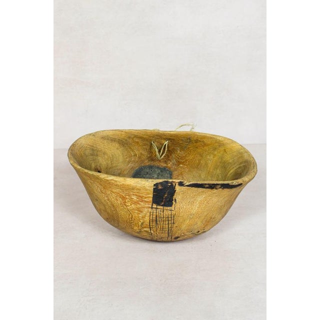 This hand-carved wooden bowl is made by the Turkana, a nomadic community in north-west Kenya prized for their woodcarving...