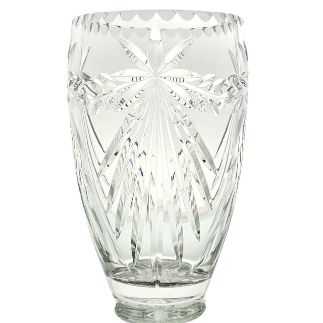 There it stands, elegant and refined, the Crystal Clear Industries Atrium vase, a sculpture in glass, its floral motifs...