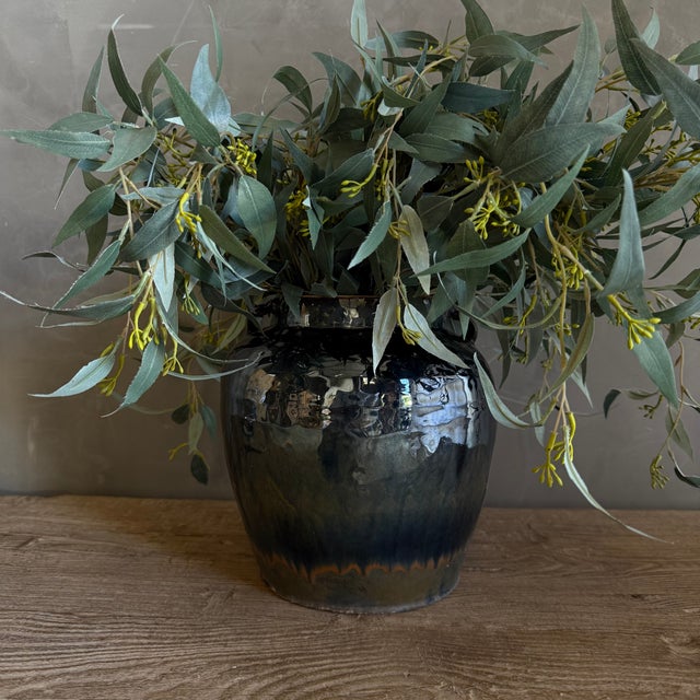 Medium black glazed pottery, wabi sabi style with perfect imperfections. Size 9.5"D x 10"H Opening: 4.5"