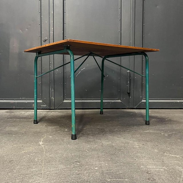 Product: side table. Style: vintage. Material: veneered in maritime pine, tubular steel frame, turquoise. Features:...
