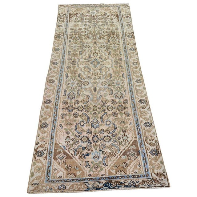 Hand-knotted with care using traditional rug-making techniques, this wool rug blends timeless craftsmanship with a modern...