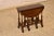 19th century oak gate leg table from England. This table has a nicely grained top, following down to a simple apron and...