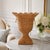 This striking Square Scalloped Trim Wicker Urn brings timeless elegance and natural texture to any interior space. Its...