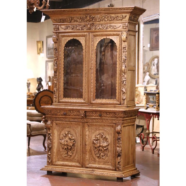 This rare antique French gun cabinet was crafted in solid oak circa 1860 and offers the scale, carving, and architectural...