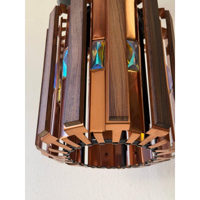 Striking Mid-Century Modern pendant lamp in style of Werner Schou, Denmark, 1960s. This piece features a beautiful...