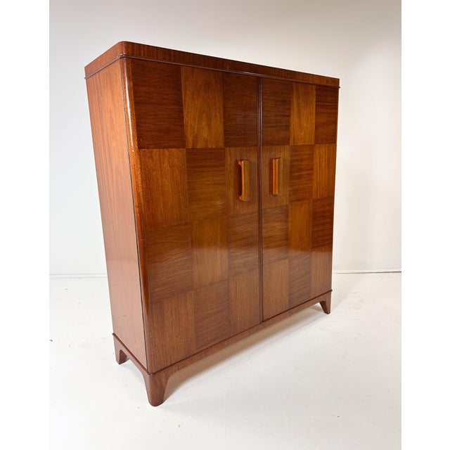 1940's Swedish Cabinet. 2 Large doors conceal interior adjustable shelves. Mahogany.