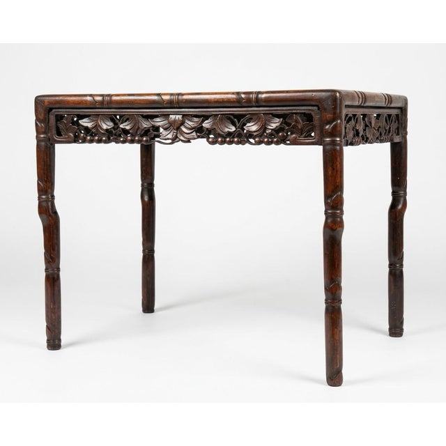 Small vintage hand carved Chinese rosewood table. Graceful lines, this table is the perfect size to put between two club...