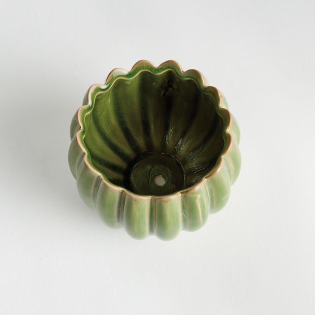 With rounded form, petallike details and thickly applied glaze, this natureinspired pot is extraordinary. The handfinished...