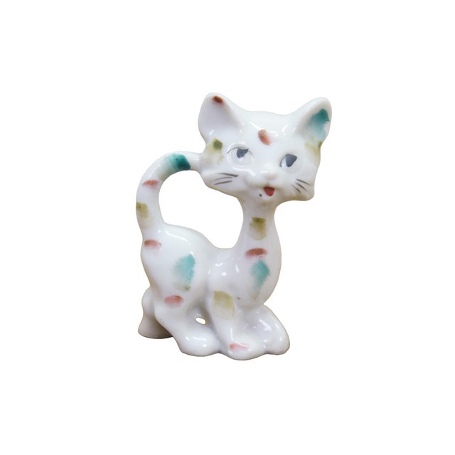 This pair of vintage mid-century Japanese porcelain cat figurines features an stylized, elongated "long neck" design...