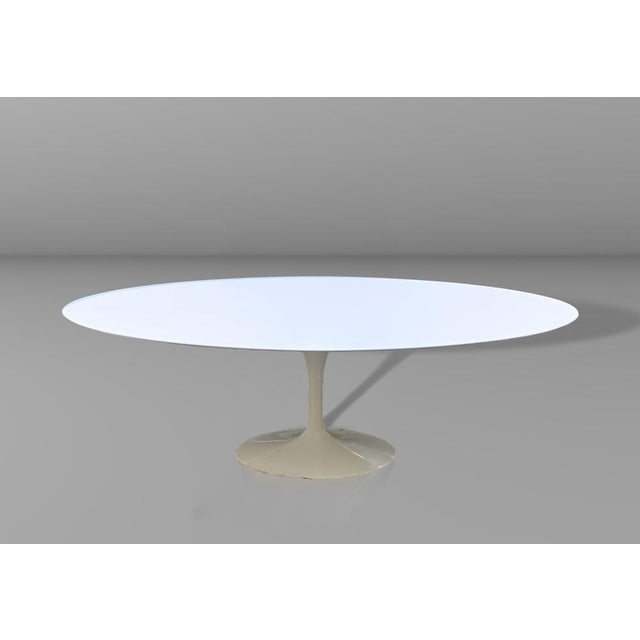 Oval table Model Tulip designed by Eero Saarinen, offered with MDF laminate top white stain-resistant and scratch-...