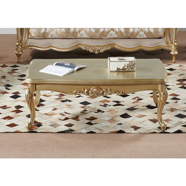 Bring the romance and grandeur of a French château into your home with this exquisite gold-finished coffee table. Inspired...