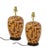 The lamps feature the iconic tortoiseshell texture, showcasing swirling patterns of dark brown, caramel, and beige. The...